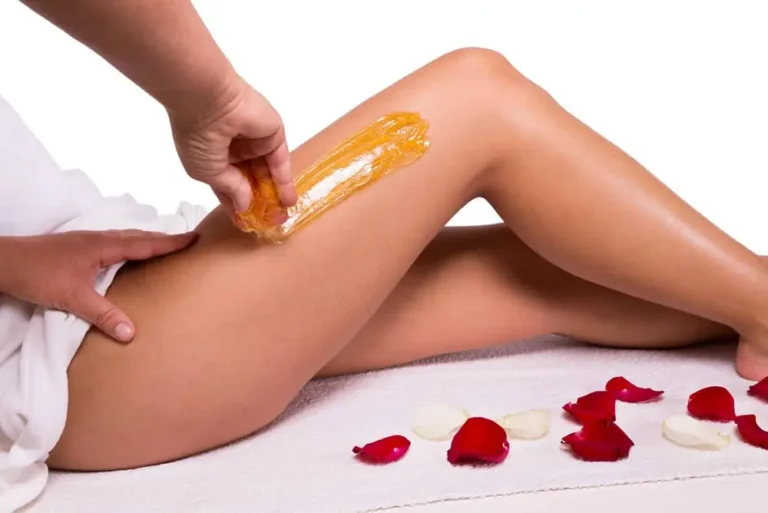 a shot of wax being applied on thigh