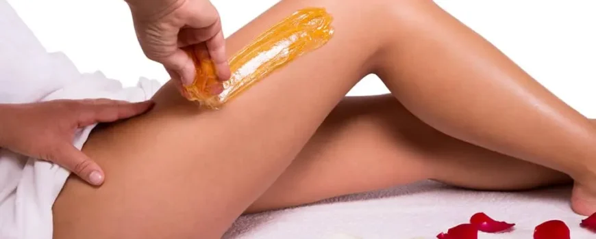 a shot of wax being applied on thigh