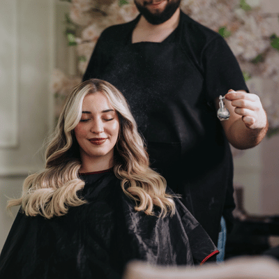 Client with fresh extensions styled and sprayed, discussing average cost of extensions before checkout today